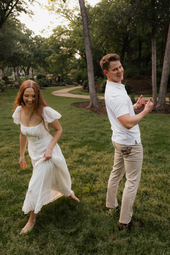Romantic engagement photos at the Grapevine Botanical Garden, capturing a couple&rsquo;s love amidst lush greenery and vibrant blooms. Perfect for couples seeking a serene, nature-inspired setting for their engagement session in DFW.