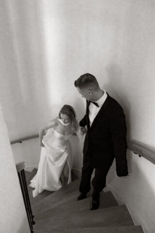 A bride and groom, take couples portraits in their modern aesthetic home at their private wedding ceremony.Timeless indoor wedding in Dallas, captured with a refined, editorial approach by DFW documentary wedding photographer.