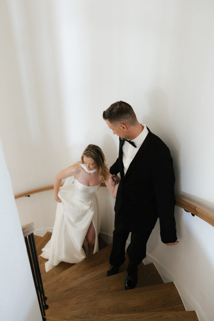 A bride and groom, take couples portraits in their modern aesthetic home at their private wedding ceremony.Timeless indoor wedding in Dallas, captured with a refined, editorial approach by DFW documentary wedding photographer.