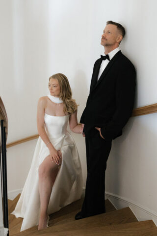 A bride and groom, take couples portraits in their modern aesthetic home at their private wedding ceremony.Timeless indoor wedding in Dallas, captured with a refined, editorial approach by DFW documentary wedding photographer.