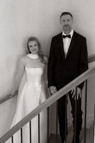 A bride and groom, take couples portraits in their modern aesthetic home at their private wedding ceremony.Timeless indoor wedding in Dallas, captured with a refined, editorial approach by DFW documentary wedding photographer.