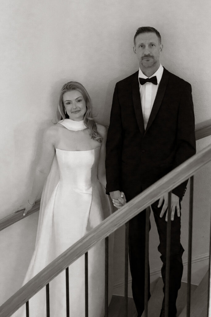 A bride and groom, take couples portraits in their modern aesthetic home at their private wedding ceremony.Timeless indoor wedding in Dallas, captured with a refined, editorial approach by DFW documentary wedding photographer.
