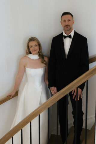 A bride and groom, take couples portraits in their modern aesthetic home at their private wedding ceremony.Timeless indoor wedding in Dallas, captured with a refined, editorial approach by DFW documentary wedding photographer.