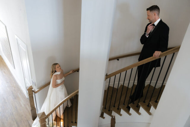 A bride and groom, take couples portraits in their modern aesthetic home at their private wedding ceremony.Timeless indoor wedding in Dallas, captured with a refined, editorial approach by DFW documentary wedding photographer.