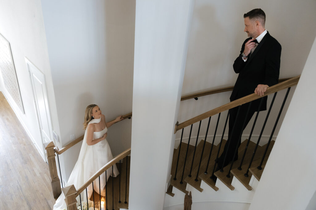A bride and groom, take couples portraits in their modern aesthetic home at their private wedding ceremony.Timeless indoor wedding in Dallas, captured with a refined, editorial approach by DFW documentary wedding photographer.