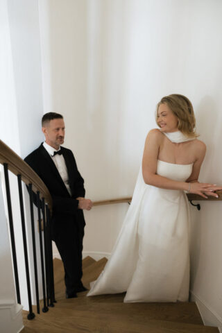 A bride and groom, take couples portraits in their modern aesthetic home at their private wedding ceremony.Timeless indoor wedding in Dallas, captured with a refined, editorial approach by DFW documentary wedding photographer.