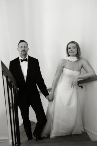 A bride and groom, take couples portraits in their modern aesthetic home at their private wedding ceremony.Timeless indoor wedding in Dallas, captured with a refined, editorial approach by DFW documentary wedding photographer.