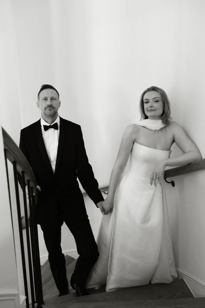 A bride and groom, take couples portraits in their modern aesthetic home at their private wedding ceremony.Timeless indoor wedding in Dallas, captured with a refined, editorial approach by DFW documentary wedding photographer.