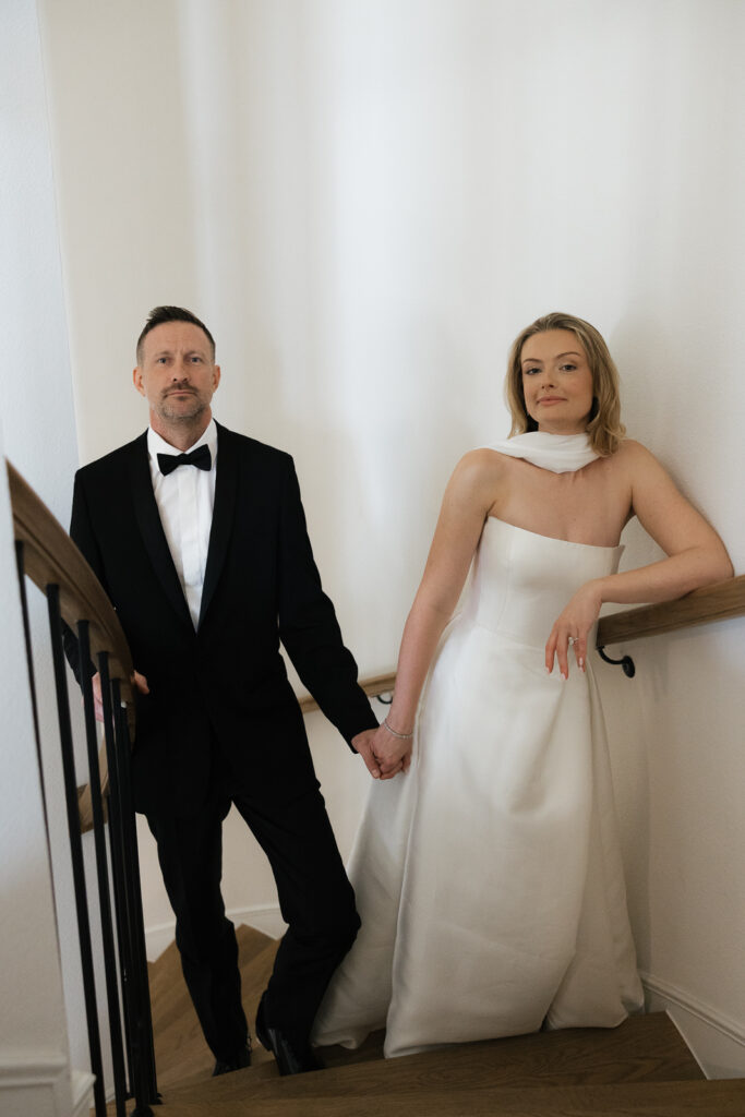 A bride and groom, take couples portraits in their modern aesthetic home at their private wedding ceremony.Timeless indoor wedding in Dallas, captured with a refined, editorial approach by DFW documentary wedding photographer.