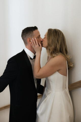 A bride and groom, take couples portraits in their modern aesthetic home at their private wedding ceremony.Timeless indoor wedding in Dallas, captured with a refined, editorial approach by DFW documentary wedding photographer.