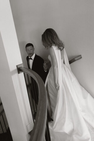 A bride and groom, take couples portraits in their modern aesthetic home at their private wedding ceremony.Timeless indoor wedding in Dallas, captured with a refined, editorial approach by DFW documentary wedding photographer.