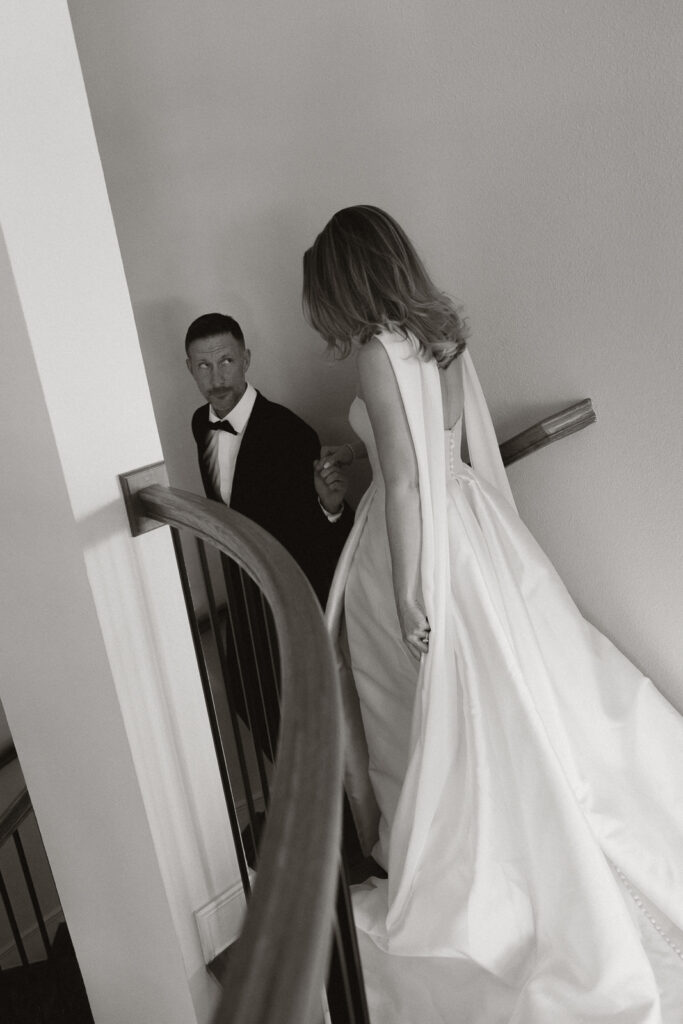 A bride and groom, take couples portraits in their modern aesthetic home at their private wedding ceremony.Timeless indoor wedding in Dallas, captured with a refined, editorial approach by DFW documentary wedding photographer.