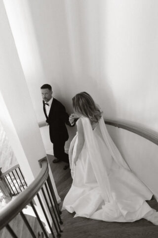 A bride and groom, take couples portraits in their modern aesthetic home at their private wedding ceremony.Timeless indoor wedding in Dallas, captured with a refined, editorial approach by DFW documentary wedding photographer.