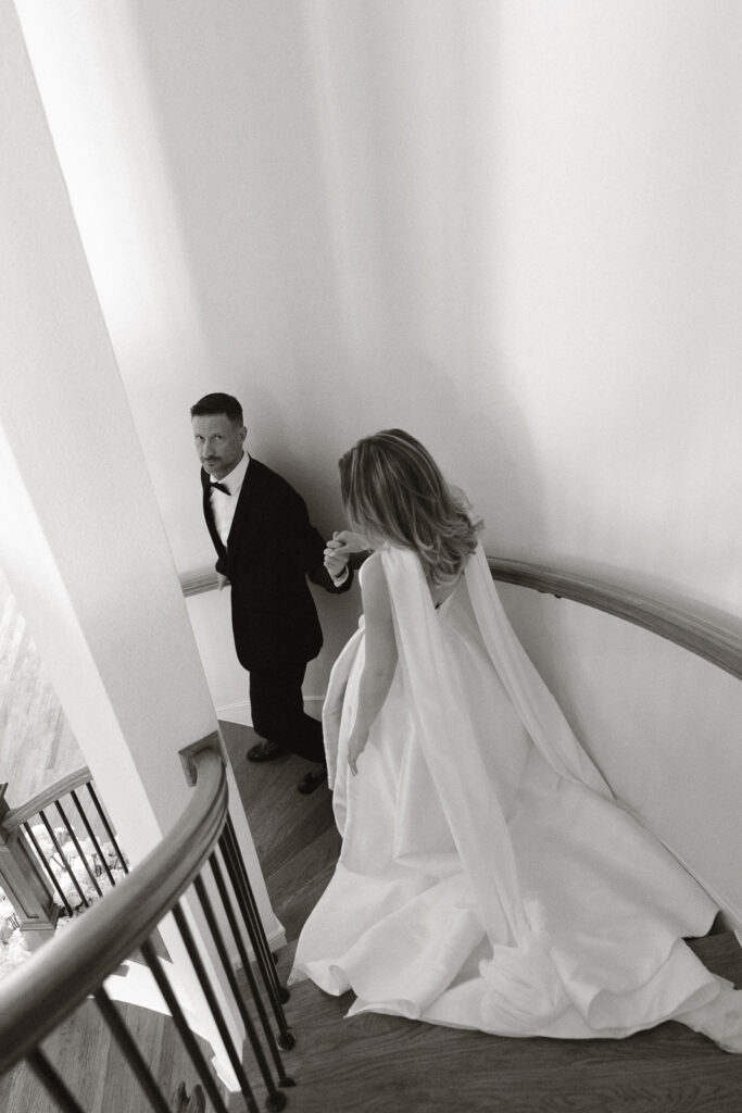 A bride and groom, take couples portraits in their modern aesthetic home at their private wedding ceremony.Timeless indoor wedding in Dallas, captured with a refined, editorial approach by DFW documentary wedding photographer.