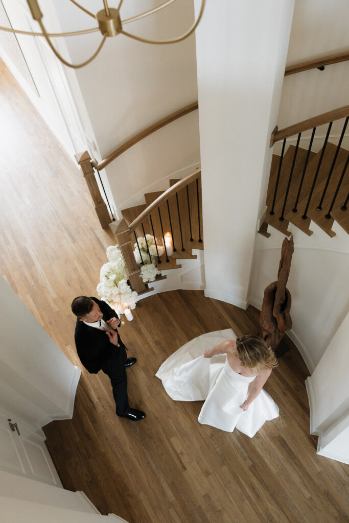 A bride and groom, take couples portraits in their modern aesthetic home at their private wedding ceremony.Timeless indoor wedding in Dallas, captured with a refined, editorial approach by DFW documentary wedding photographer.