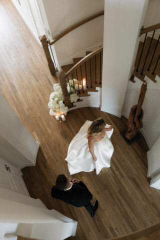 A bride and groom, take couples portraits in their modern aesthetic home at their private wedding ceremony.Timeless indoor wedding in Dallas, captured with a refined, editorial approach by DFW documentary wedding photographer.