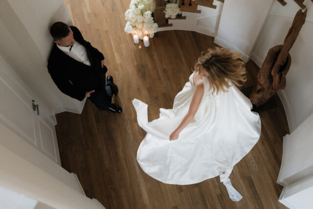 A bride and groom, take couples portraits in their modern aesthetic home at their private wedding ceremony.Timeless indoor wedding in Dallas, captured with a refined, editorial approach by DFW documentary wedding photographer.