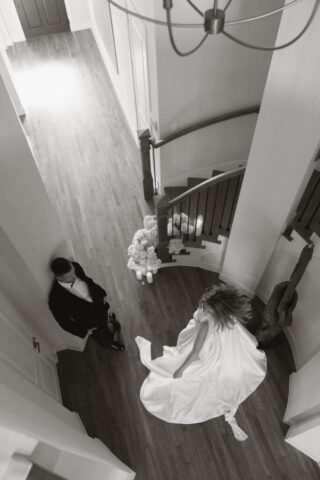 A bride and groom, take couples portraits in their modern aesthetic home at their private wedding ceremony.Timeless indoor wedding in Dallas, captured with a refined, editorial approach by DFW documentary wedding photographer.