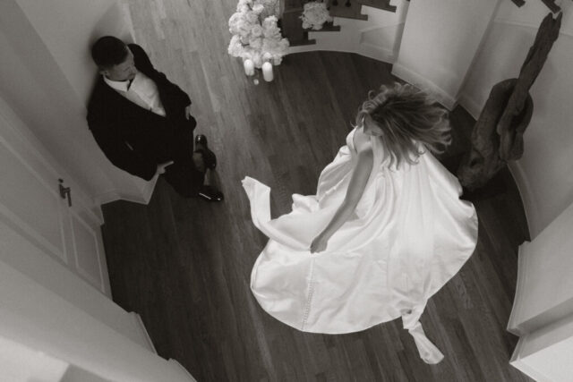 A bride and groom, take couples portraits in their modern aesthetic home at their private wedding ceremony.Timeless indoor wedding in Dallas, captured with a refined, editorial approach by DFW documentary wedding photographer.