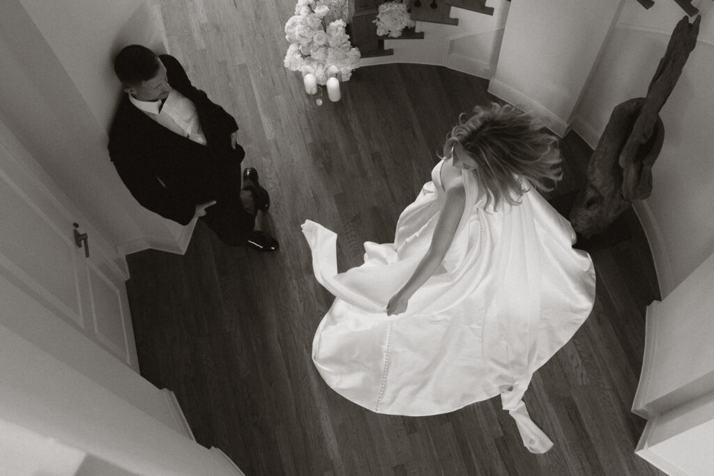 A bride and groom, take couples portraits in their modern aesthetic home at their private wedding ceremony.Timeless indoor wedding in Dallas, captured with a refined, editorial approach by DFW documentary wedding photographer.