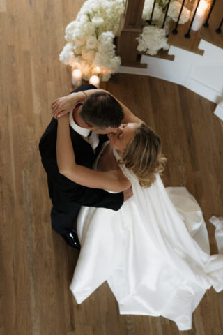 A bride and groom, take couples portraits in their modern aesthetic home at their private wedding ceremony.Timeless indoor wedding in Dallas, captured with a refined, editorial approach by DFW documentary wedding photographer.