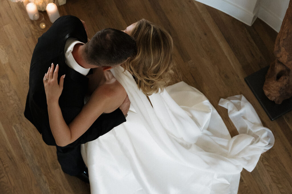 A bride and groom, take couples portraits in their modern aesthetic home at their private wedding ceremony.Timeless indoor wedding in Dallas, captured with a refined, editorial approach by DFW documentary wedding photographer.