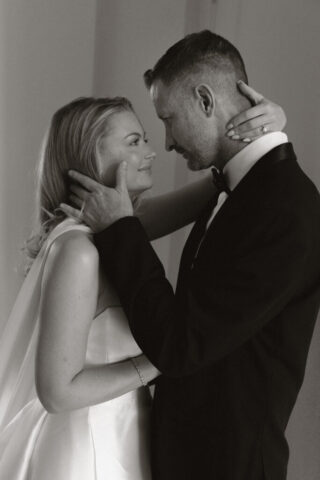 A bride and groom, take couples portraits in their modern aesthetic home at their private wedding ceremony.Timeless indoor wedding in Dallas, captured with a refined, editorial approach by DFW documentary wedding photographer.