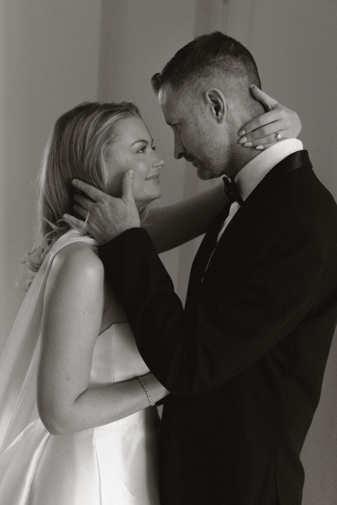 A bride and groom, take couples portraits in their modern aesthetic home at their private wedding ceremony.Timeless indoor wedding in Dallas, captured with a refined, editorial approach by DFW documentary wedding photographer.