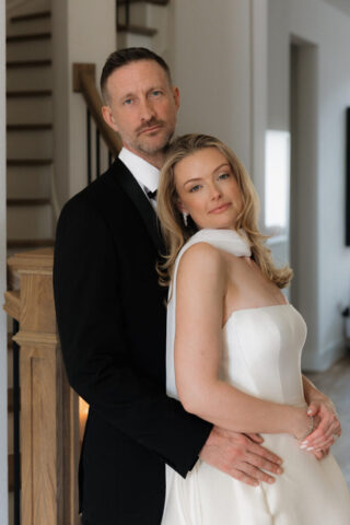 A bride and groom, take couples portraits in their modern aesthetic home at their private wedding ceremony.Timeless indoor wedding in Dallas, captured with a refined, editorial approach by DFW documentary wedding photographer.