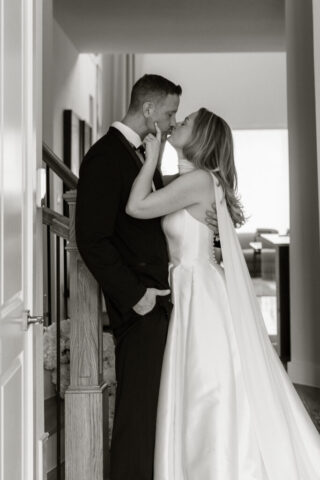 A bride and groom, take couples portraits in their modern aesthetic home at their private wedding ceremony.Timeless indoor wedding in Dallas, captured with a refined, editorial approach by DFW documentary wedding photographer.