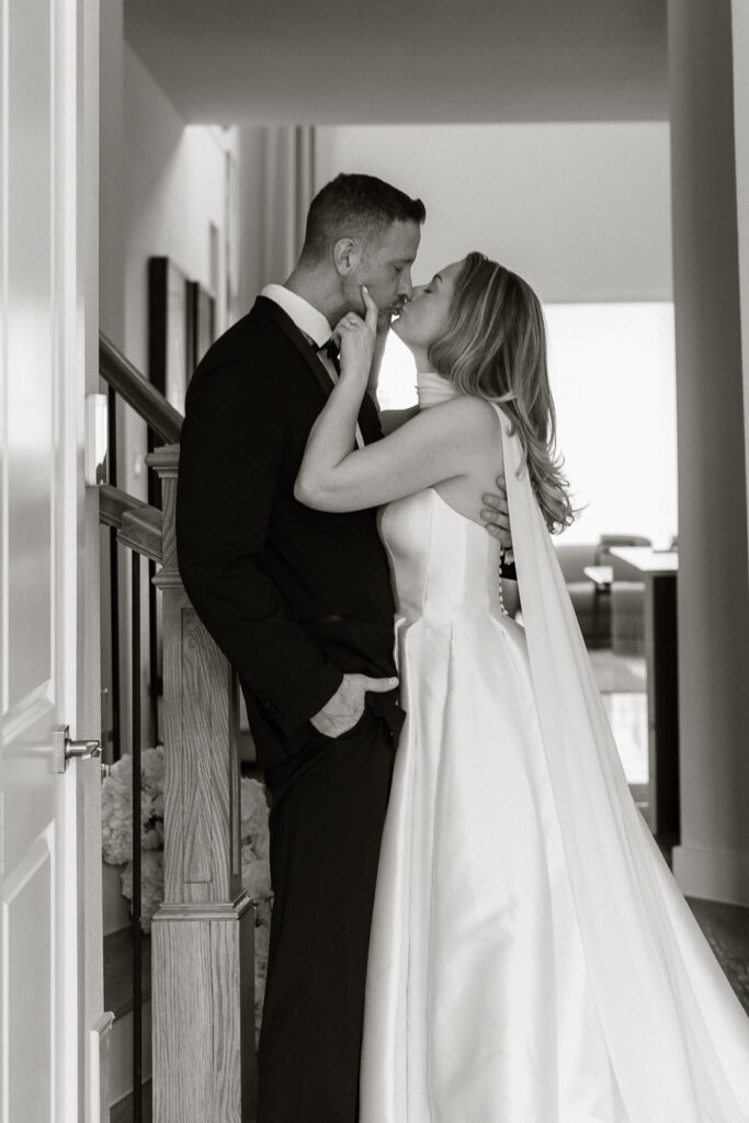 A bride and groom, take couples portraits in their modern aesthetic home at their private wedding ceremony.Timeless indoor wedding in Dallas, captured with a refined, editorial approach by DFW documentary wedding photographer.