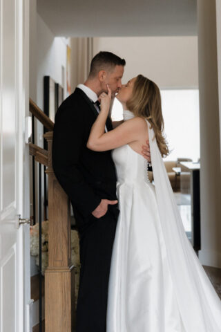 A bride and groom, take couples portraits in their modern aesthetic home at their private wedding ceremony.Timeless indoor wedding in Dallas, captured with a refined, editorial approach by DFW documentary wedding photographer.