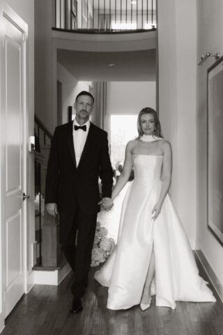 A bride and groom, take couples portraits in their modern aesthetic home at their private wedding ceremony.Timeless indoor wedding in Dallas, captured with a refined, editorial approach by DFW documentary wedding photographer.