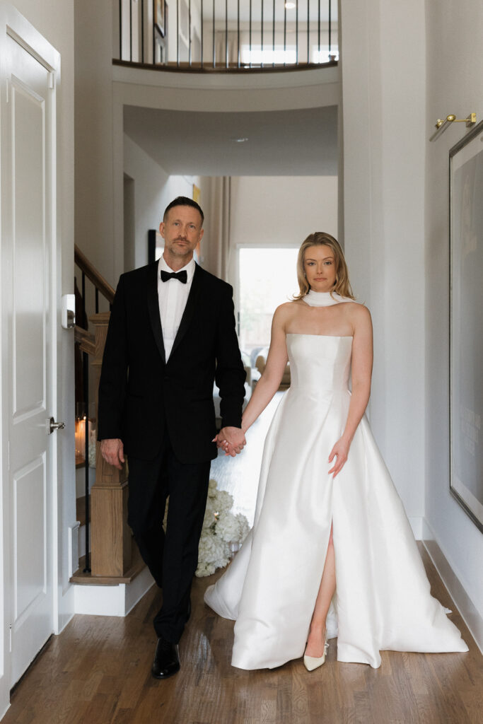 A bride and groom, take couples portraits in their modern aesthetic home at their private wedding ceremony.Timeless indoor wedding in Dallas, captured with a refined, editorial approach by DFW documentary wedding photographer.