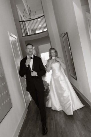 A bride and groom, take couples portraits in their modern aesthetic home at their private wedding ceremony.Timeless indoor wedding in Dallas, captured with a refined, editorial approach by DFW documentary wedding photographer.