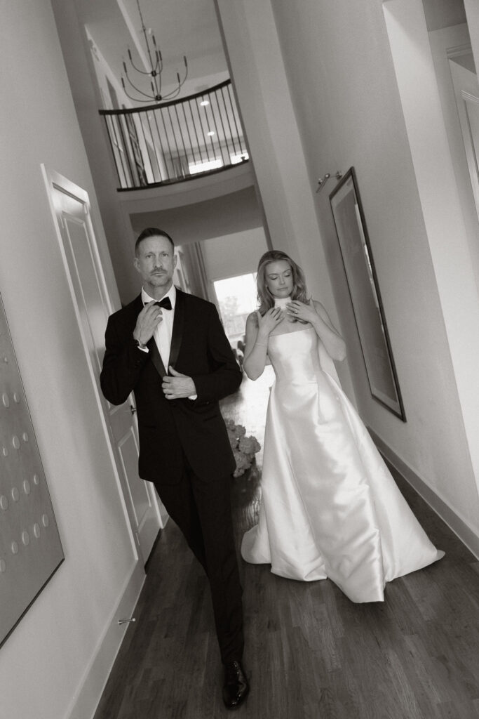 A bride and groom, take couples portraits in their modern aesthetic home at their private wedding ceremony.Timeless indoor wedding in Dallas, captured with a refined, editorial approach by DFW documentary wedding photographer.
