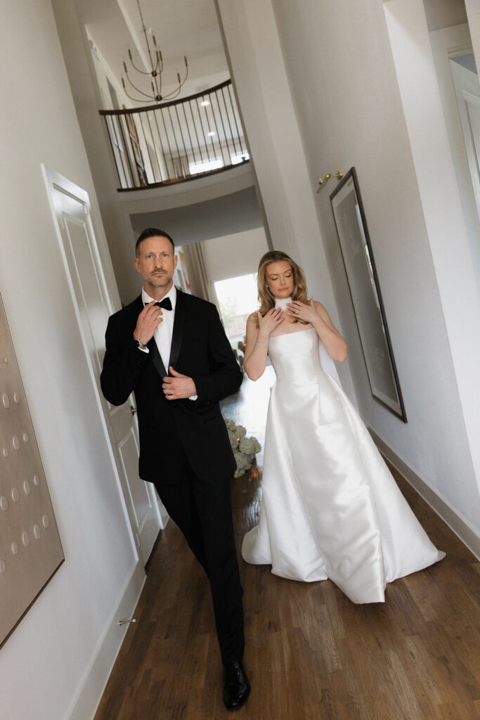 A bride and groom, take couples portraits in their modern aesthetic home at their private wedding ceremony.Timeless indoor wedding in Dallas, captured with a refined, editorial approach by DFW documentary wedding photographer.