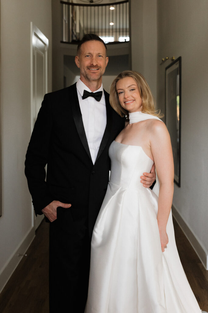 A bride and groom, take couples portraits in their modern aesthetic home at their private wedding ceremony.Timeless indoor wedding in Dallas, captured with a refined, editorial approach by DFW documentary wedding photographer.