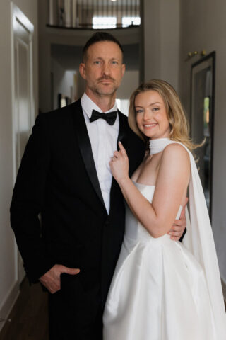 A bride and groom, take couples portraits in their modern aesthetic home at their private wedding ceremony.Timeless indoor wedding in Dallas, captured with a refined, editorial approach by DFW documentary wedding photographer.