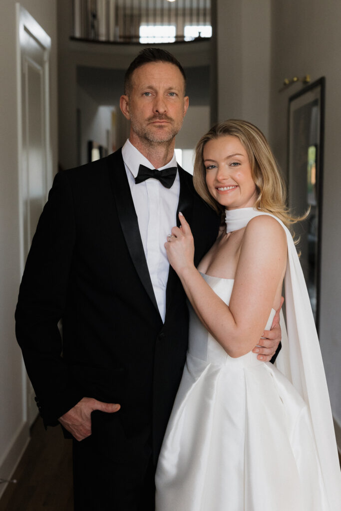 A bride and groom, take couples portraits in their modern aesthetic home at their private wedding ceremony.Timeless indoor wedding in Dallas, captured with a refined, editorial approach by DFW documentary wedding photographer.