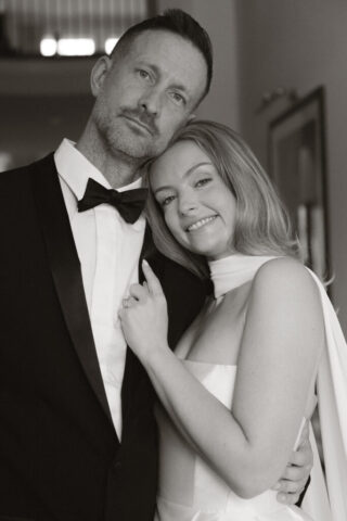 A bride and groom, take couples portraits in their modern aesthetic home at their private wedding ceremony.Timeless indoor wedding in Dallas, captured with a refined, editorial approach by DFW documentary wedding photographer.