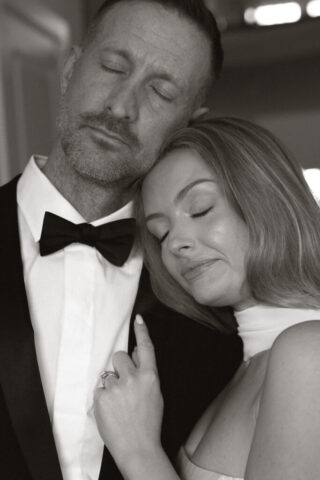 A bride and groom, take couples portraits in their modern aesthetic home at their private wedding ceremony.Timeless indoor wedding in Dallas, captured with a refined, editorial approach by DFW documentary wedding photographer.