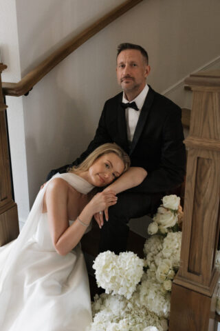 A bride and groom, take couples portraits in their modern aesthetic home at their private wedding ceremony.Timeless indoor wedding in Dallas, captured with a refined, editorial approach by DFW documentary wedding photographer.