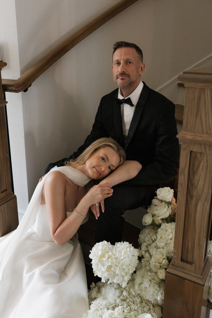 A bride and groom, take couples portraits in their modern aesthetic home at their private wedding ceremony.Timeless indoor wedding in Dallas, captured with a refined, editorial approach by DFW documentary wedding photographer.