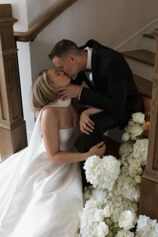 A bride and groom, take couples portraits in their modern aesthetic home at their private wedding ceremony.Timeless indoor wedding in Dallas, captured with a refined, editorial approach by DFW documentary wedding photographer.