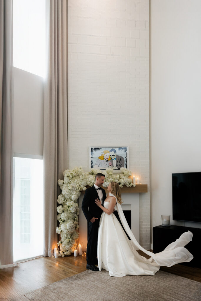 A bride and groom, take couples portraits in their modern aesthetic home at their private wedding ceremony.Timeless indoor wedding in Dallas, captured with a refined, editorial approach by DFW documentary wedding photographer.