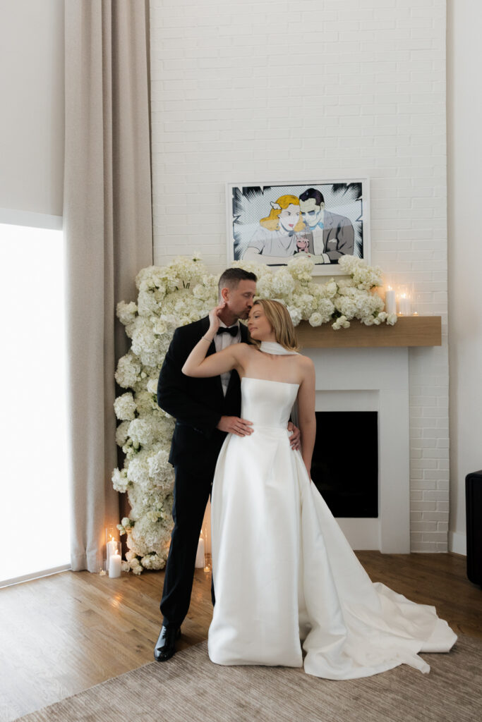 A bride and groom, take couples portraits in their modern aesthetic home at their private wedding ceremony.Timeless indoor wedding in Dallas, captured with a refined, editorial approach by DFW documentary wedding photographer.
