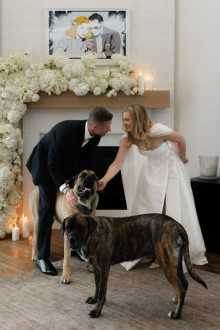 A bride and groom take photos with their pet dog in their modern aesthetic home at their private wedding ceremony.Timeless indoor wedding in Dallas, captured with a refined, editorial approach by DFW documentary wedding photographer.