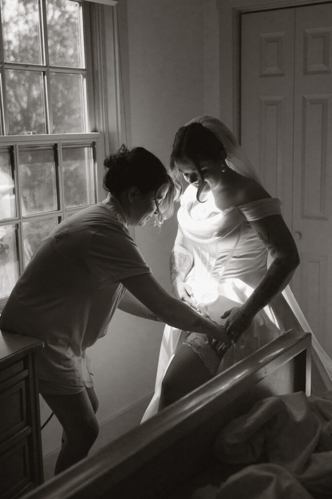 Bride preparing for wedding with help