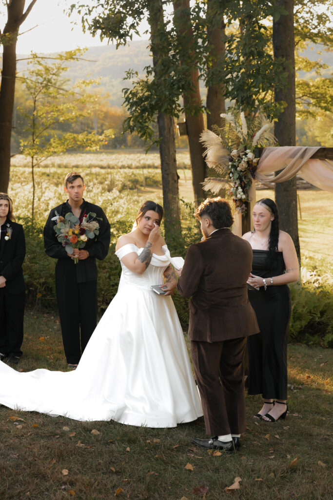 Bride in white dress at outdoor wedding ceremony